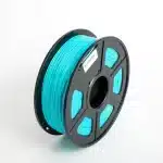 The image shows a spool of Sunlu PLA+ filament in a vibrant cyan color. The filament is wound neatly onto a black plastic spool with several cutout sections that reveal the tightly wound filament. A small label is affixed to the spool, providing product details. The color of the filament is bright and striking, ideal for 3D printing projects requiring a bold hue.